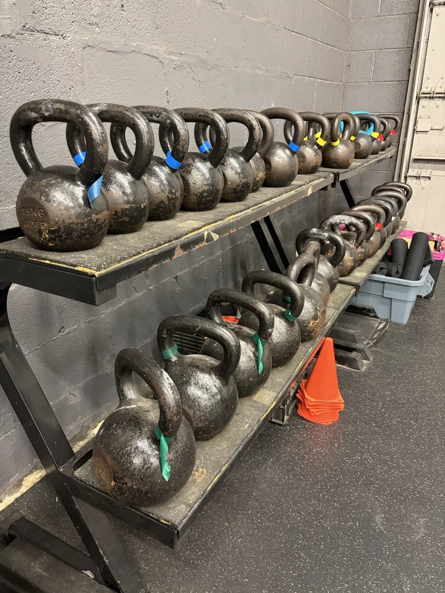 Barbell and plate storage station at Vickery Athletics strength training gym in East Dallas